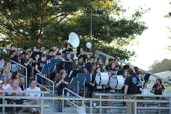 HMS band playing in stands at football game
